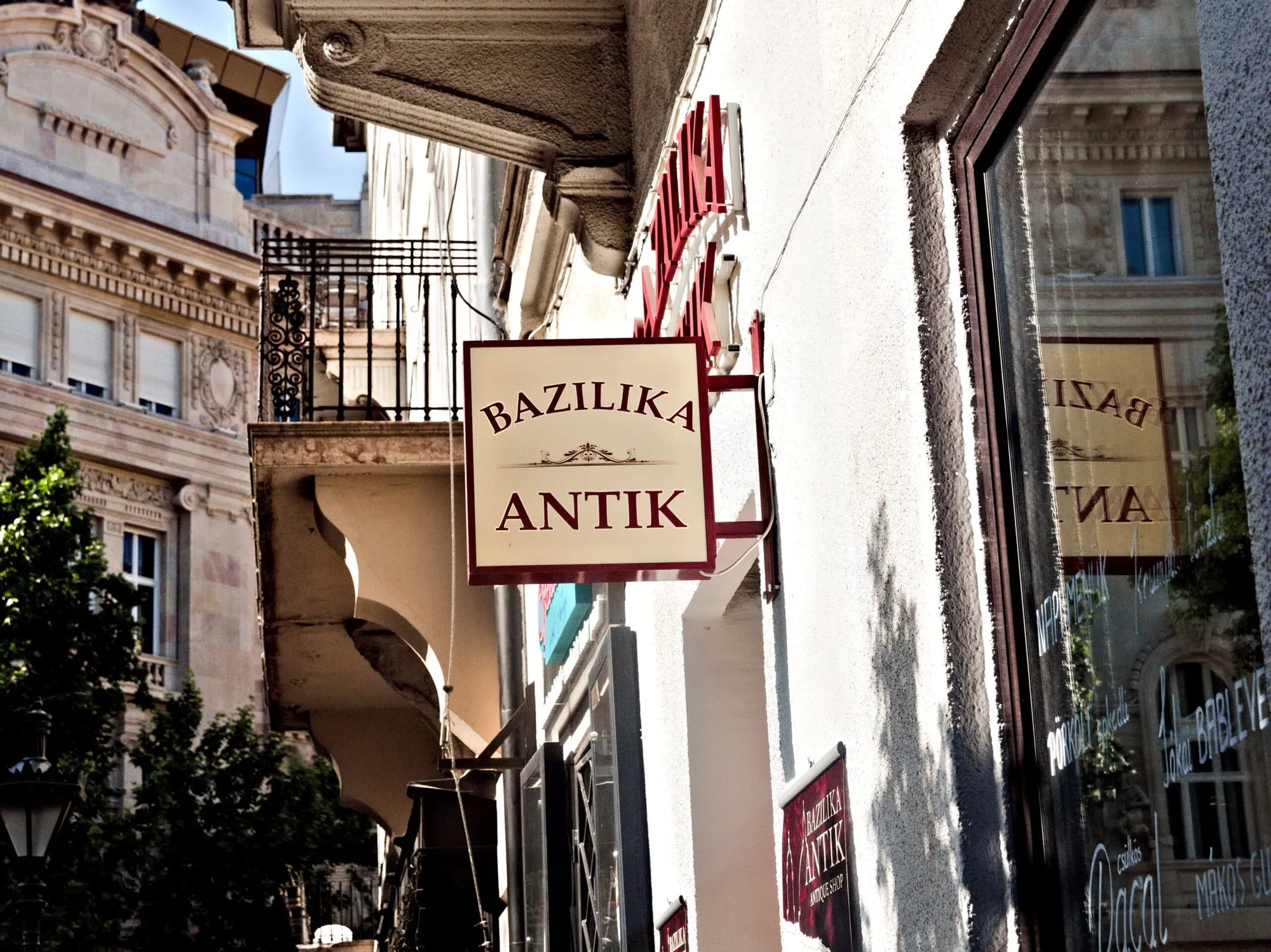An antique shop sign near the Basilica